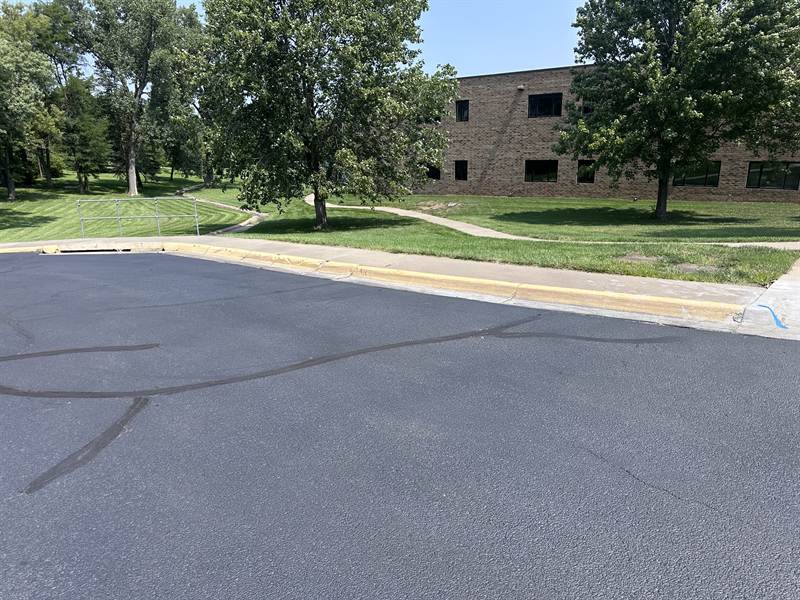 Faded yellow curb paint before repainting